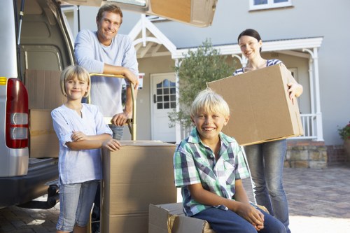 Professional movers protecting household items during a local relocation